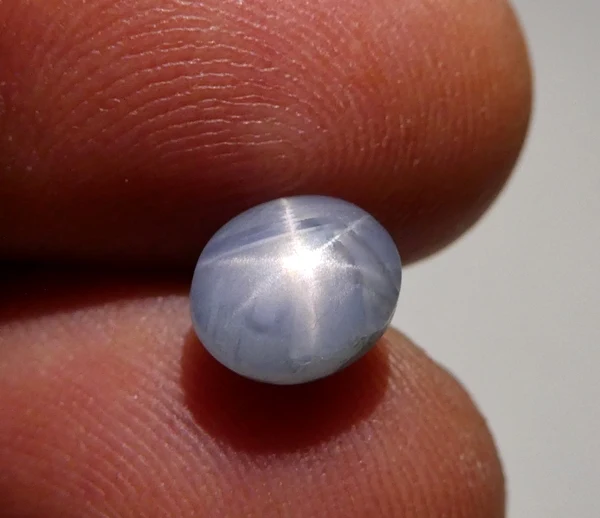 Ceylon star sapphire cabochon showing six-ray asterism